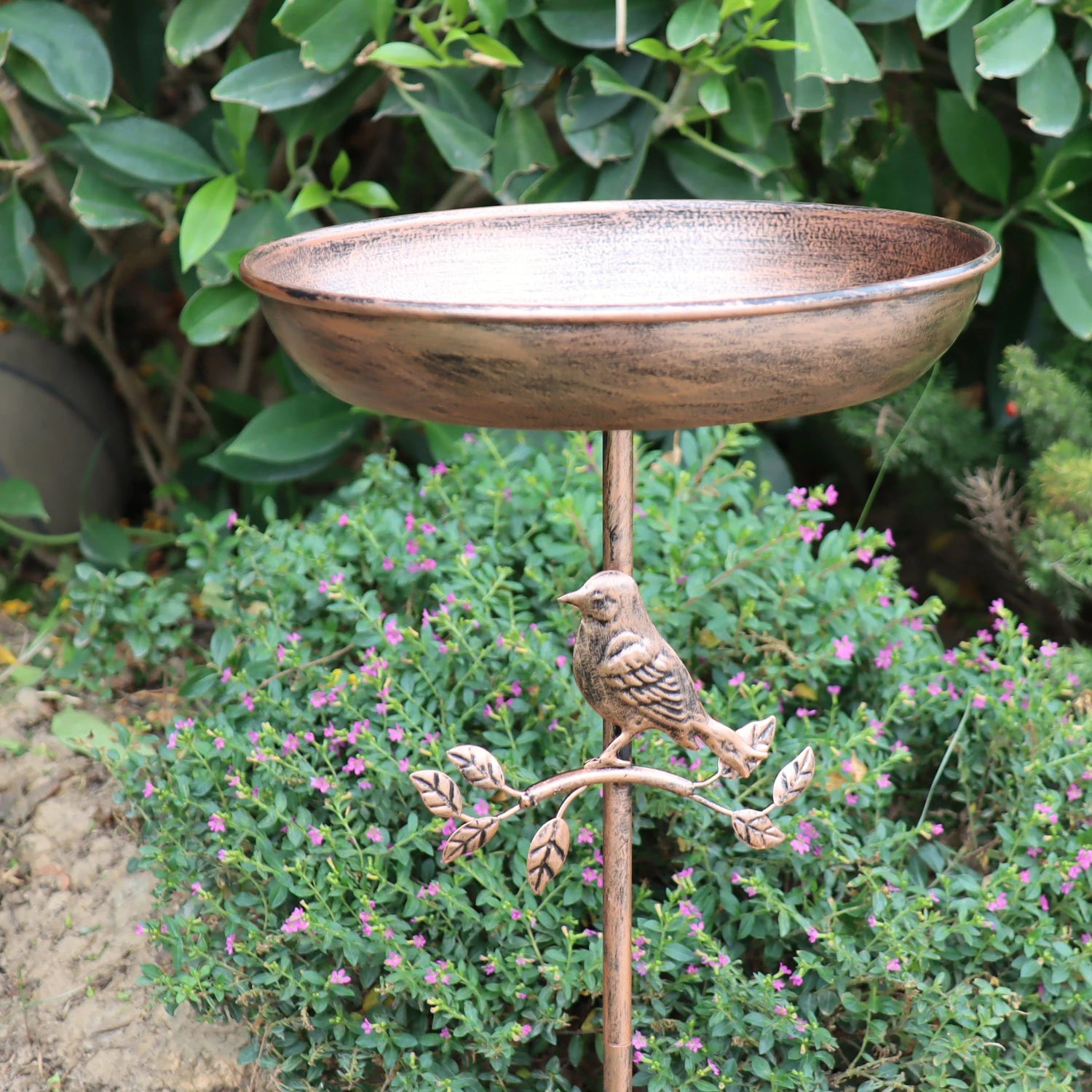 A wrought iron bird bath and feeder in one, featuring a rust-proof design and a stable 5-prong ground stake.  Perfect for garden